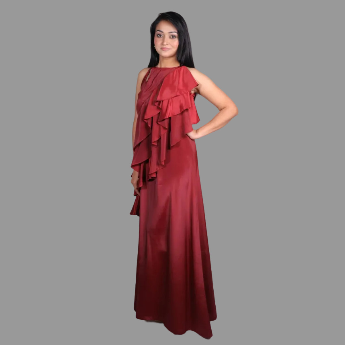 Woman wearing a red evening gown against a white background
