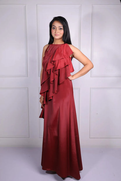 Woman wearing a red evening gown against a white background