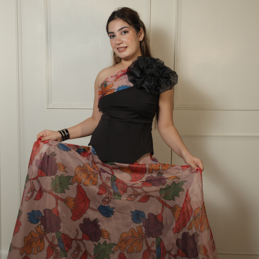 Woman holding a colorful floral scarf against a neutral background